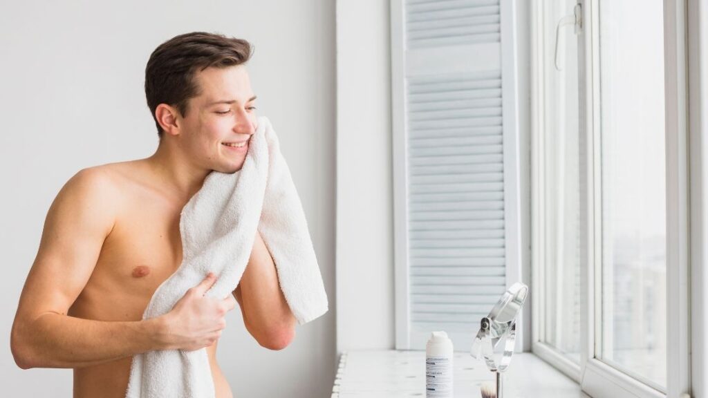 Start by splashing lukewarm water